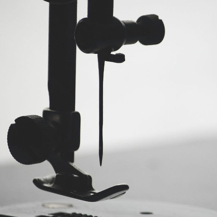 close up of a sewing machine with a needle, craftsmanship, beautiful craftsmanship, stitching